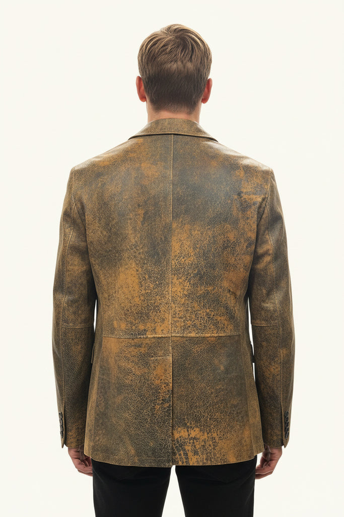 Antic leather jacket hanging on a rack with folded clothes underneath