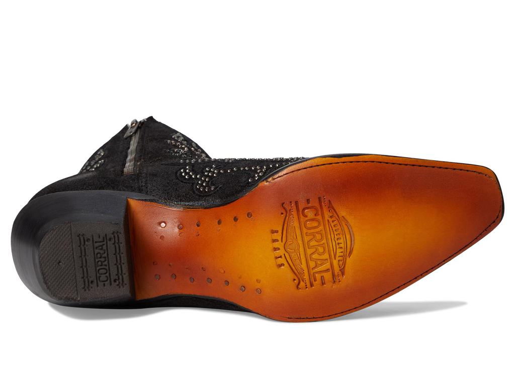 Close-up of a shoe sole with 'Corral' branding on a white background