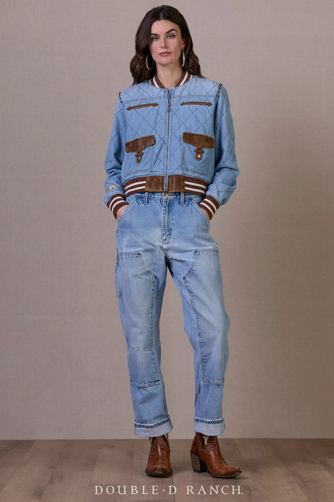 Woman wearing a denim jacket and jeans with brown accents against a plain background, branded 'Double-D Ranch'.