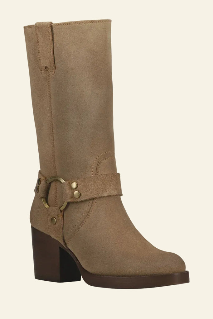 Brown knee-high boot with a buckle on a light gray background