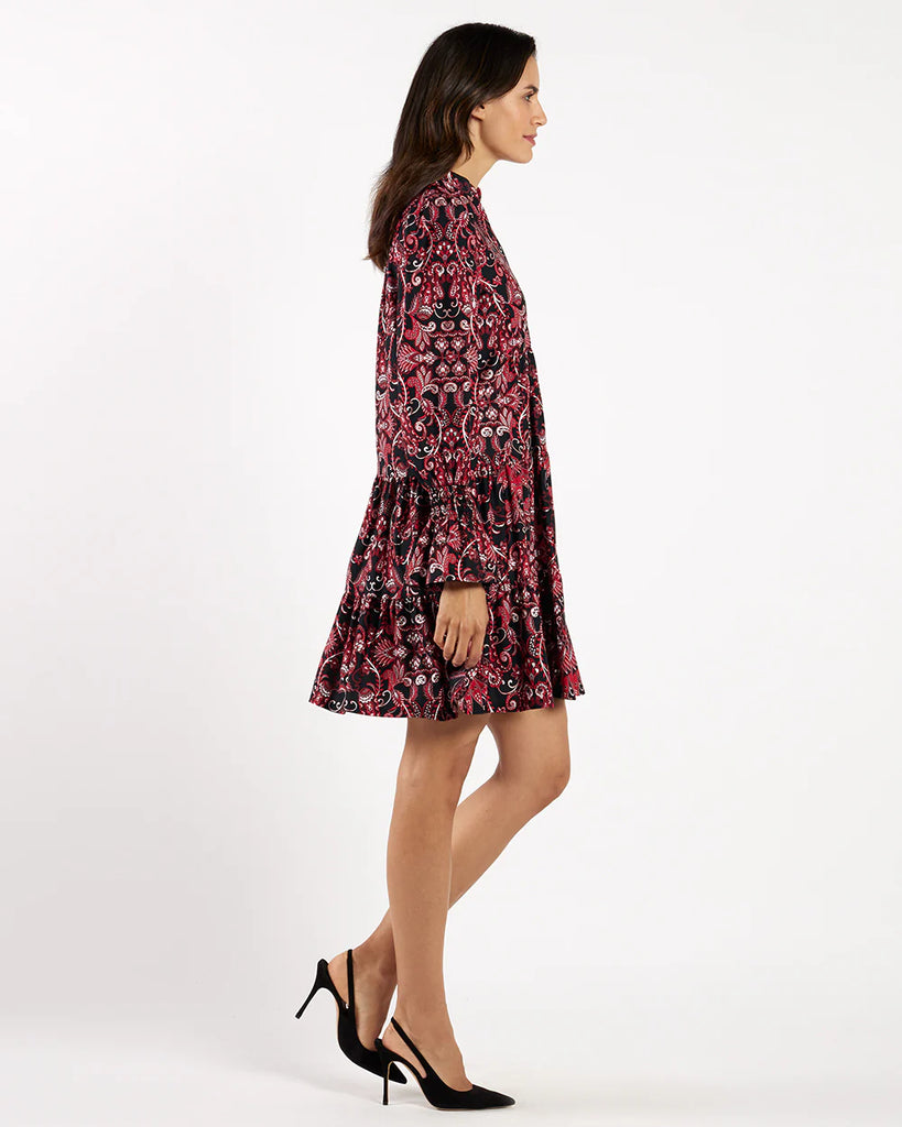 Woman wearing a floral dress on a white background