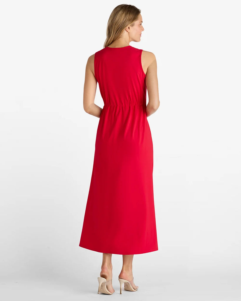Woman wearing a red dress on a white background
