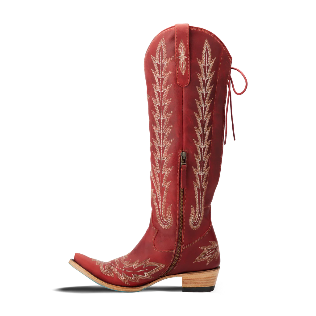 Red cowboy boot with white embroidery on a white background