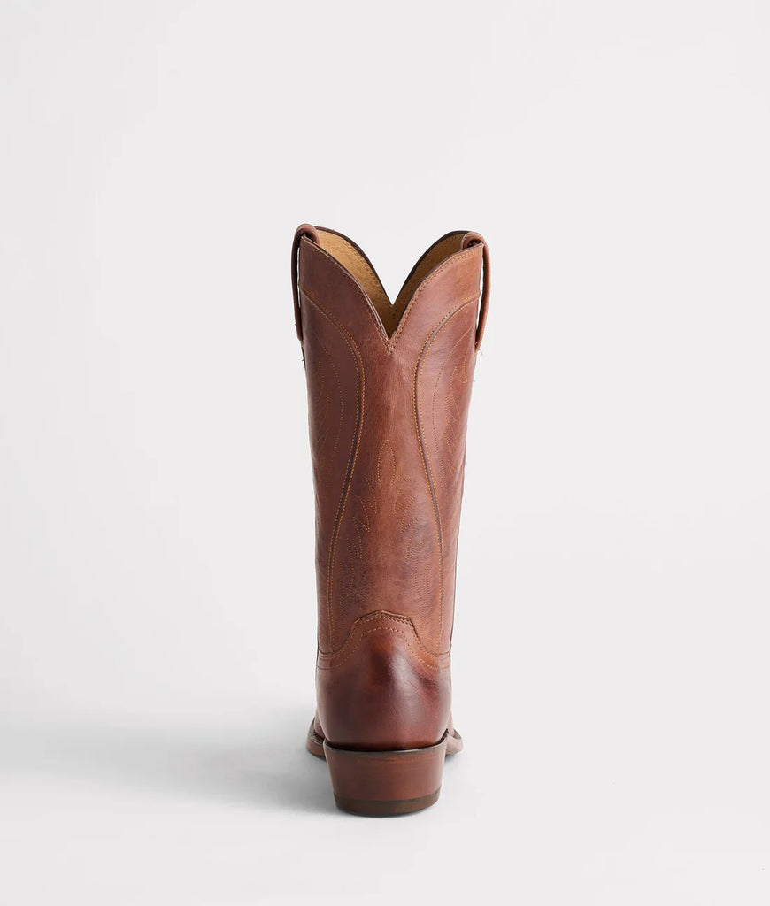 Brown leather cowboy boot on a white background