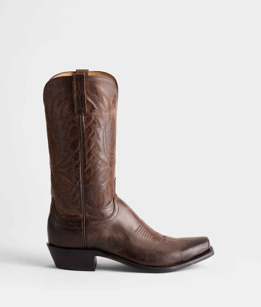 Brown leather cowboy boot on a white background