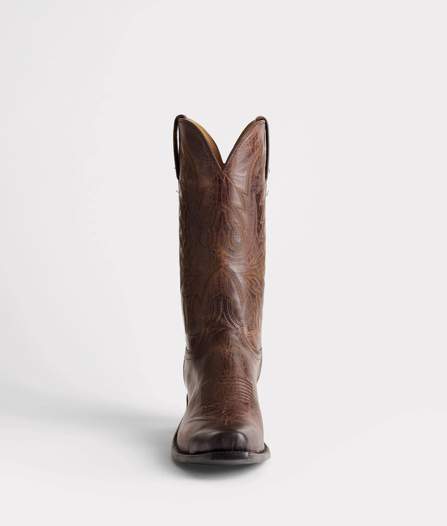 Brown cowboy boot on a white background