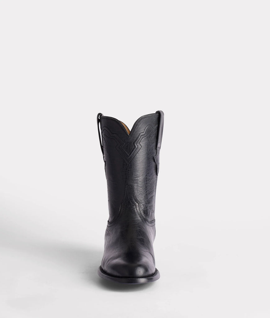 Black cowboy boot on a white background
