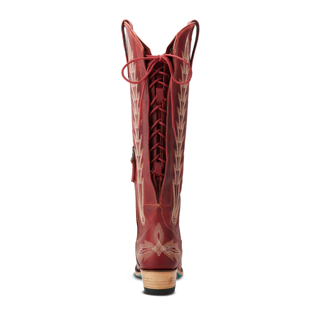 Red cowboy boot with intricate design on a white background