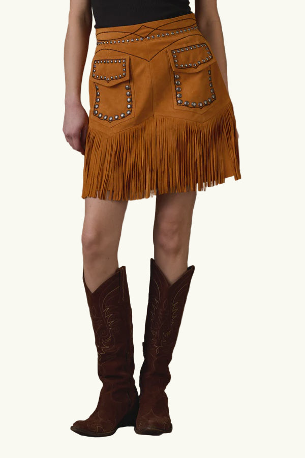 Person wearing a brown fringed skirt and cowboy boots on a brown background with 'Double-D Ranch' branding.