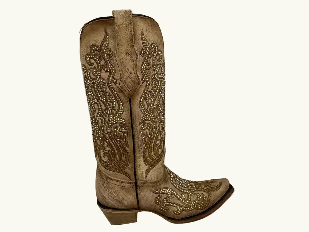 Beige cowboy boot with intricate patterns on a white background