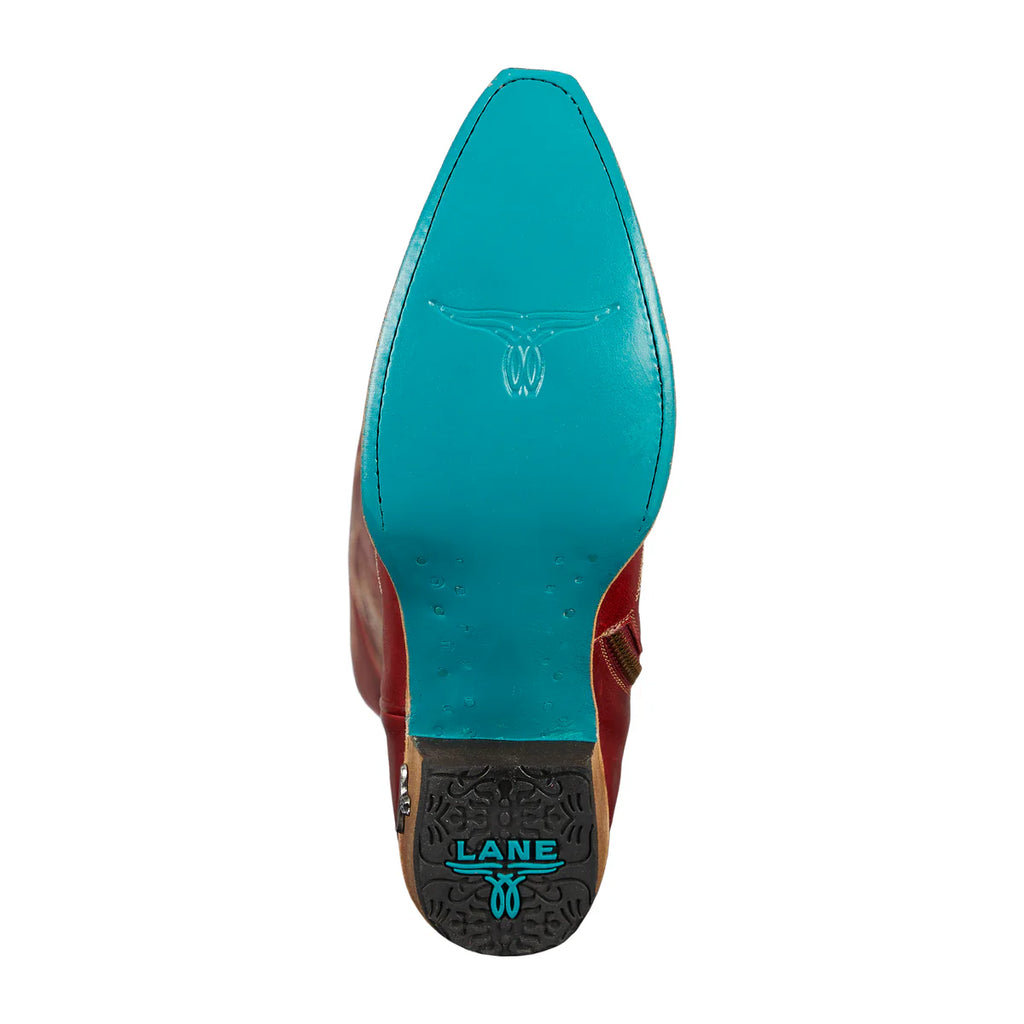 Close-up of a shoe with teal uppers and brown soles on a white background
