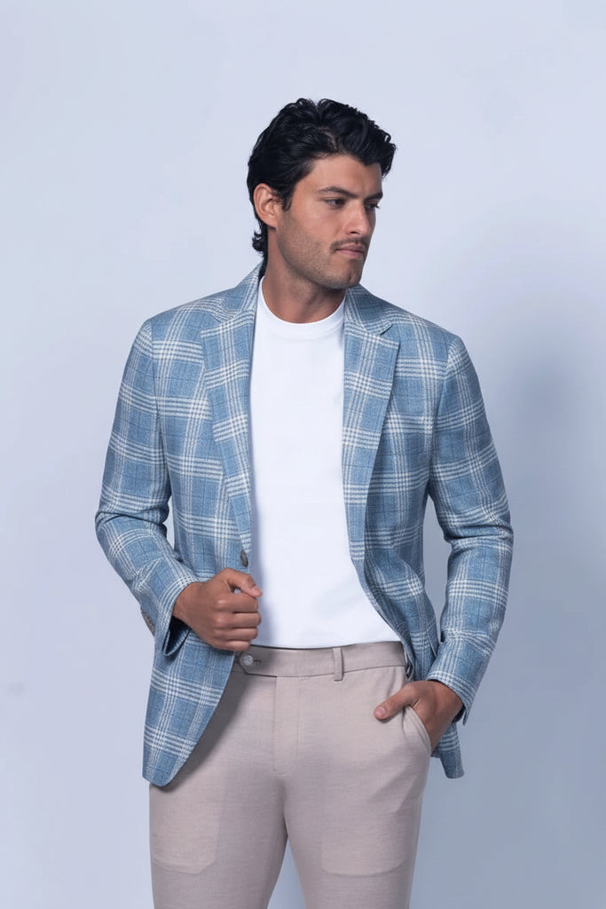 dark haired man in a bue sports coat