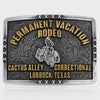 Belt buckle with 'Permanent Vacation Rodeo' text and decorative design on a white background