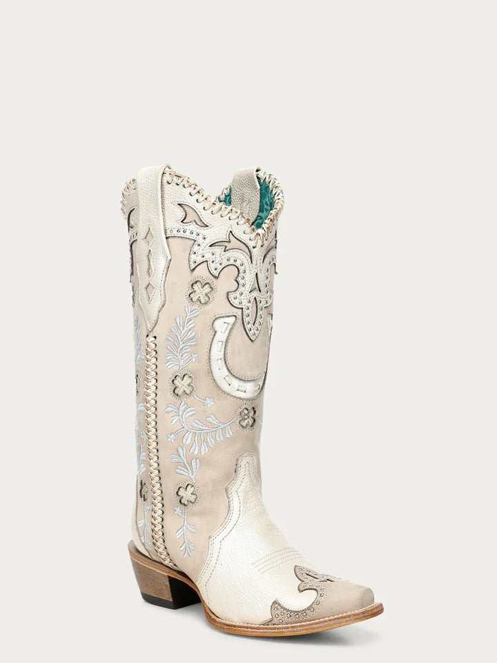 White embroidered cowboy boot with floral designs on a white background