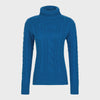 Blue cable knit turtleneck sweater on a light gray background
