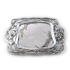 Silver decorative plate with intricate designs on a white background