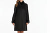 Black cashmere coat with mink fur trim on a mannequin against a neutral background