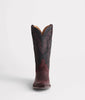 Brown cowboy boot with black sole on a white background