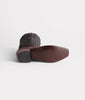 Brown leather boot sole on a white background