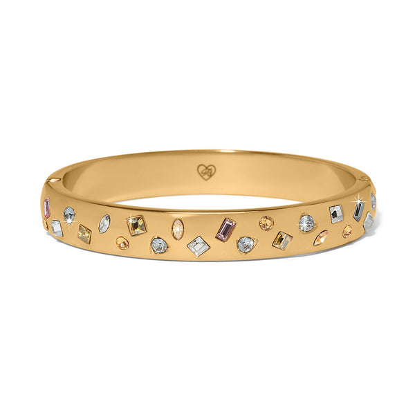 Gold bracelet with embedded crystals on a white background