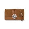 Brown leather clutch with decorative emblem and strap on a white background
