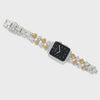 Silver and gold watch with a black face on a white background