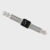 Silver watch with a black face on a white background