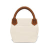 White handbag with brown woven handles on a white background