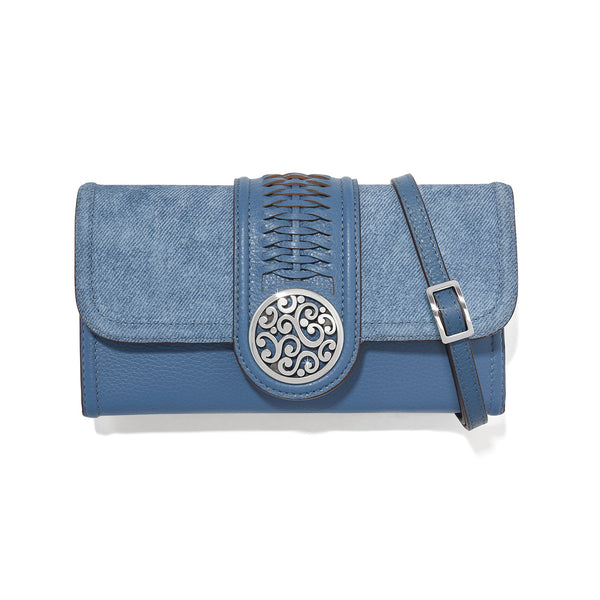 Blue clutch bag with decorative buckle on a white background