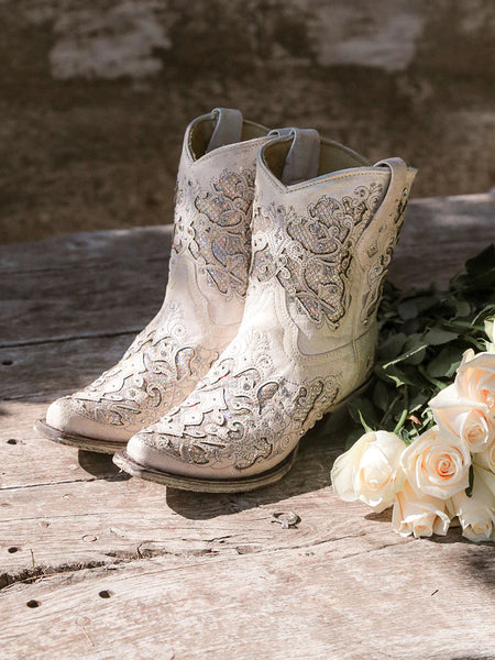 INSPIRED BY THE TALLER SHAFT MARTINA WEDDING COLLECTION BOOT, CORRAL CREATED A SHORTY VERSION FOR THE DARING AND BOLD BRIDE! DESIGNED TO BE WORN ANYWHERE