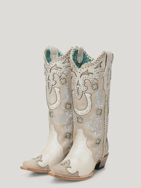 Pair of white cowboy boots with intricate designs on a light gray background