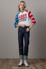 Woman wearing a patriotic-themed sweatshirt with 'LADY LIBERTY' text, standing against a plain background.