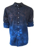 Blue tie-dye shirt with rolled-up sleeves on a white background Georg Roth brings European craftsmanship and California style together, creating men’s and women’s shirts known for bold color, 