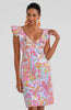 Woman wearing a colorful patterned dress on a white background