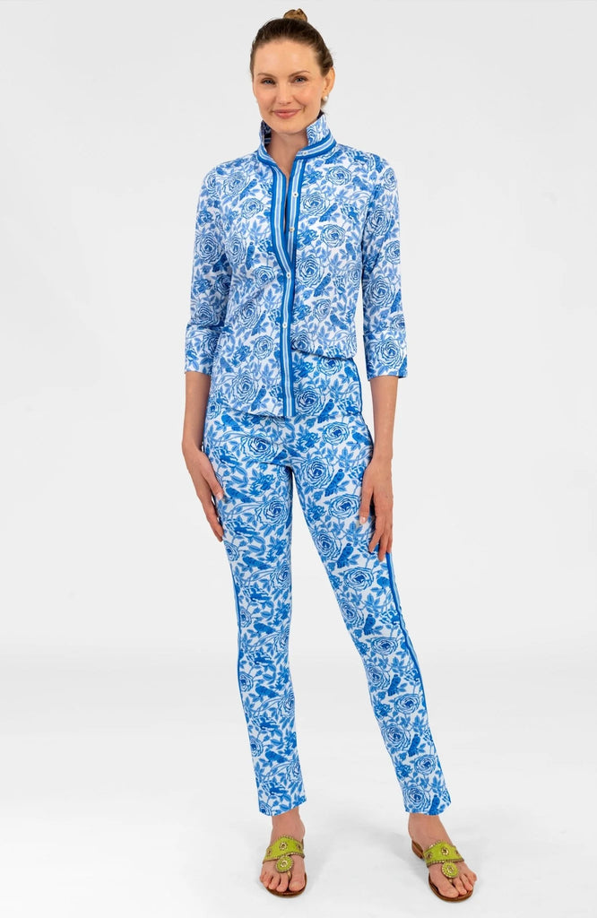 Woman wearing a blue floral outfit on a white background