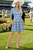 Woman wearing a blue floral dress on a white background