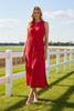 Woman wearing a red dress at the racetrack