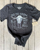 Black t-shirt with graphic design and text on a wooden surface