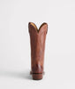 Brown leather cowboy boot on a white background