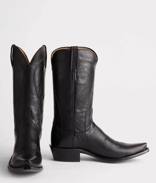 Pair of black leather cowboy boots on a white background