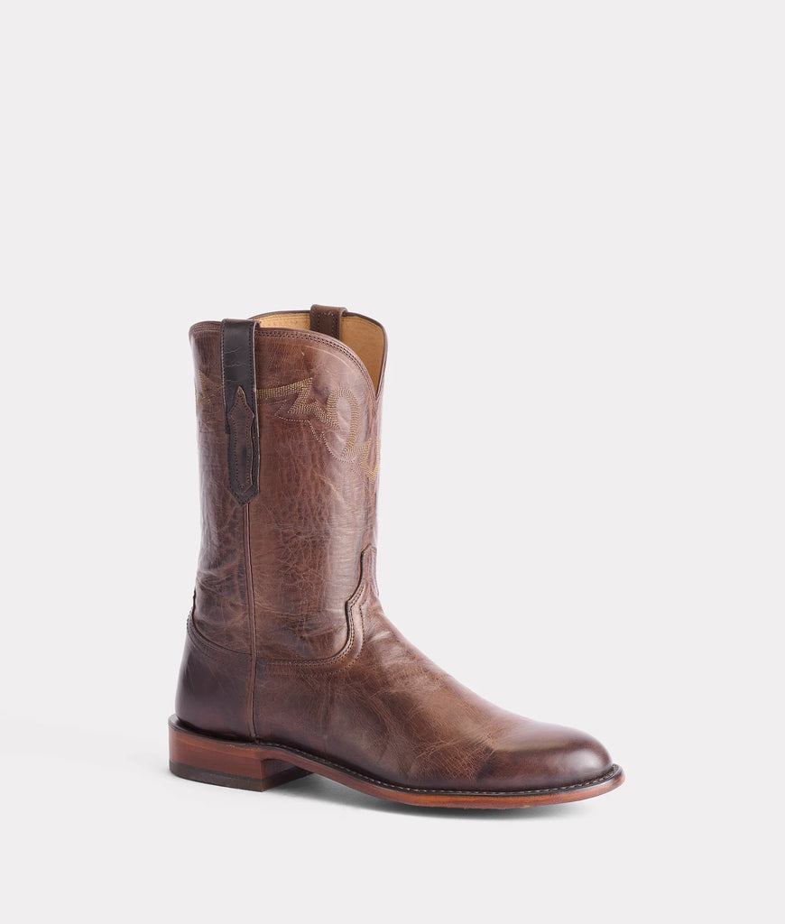 Brown leather boot on a light gray background