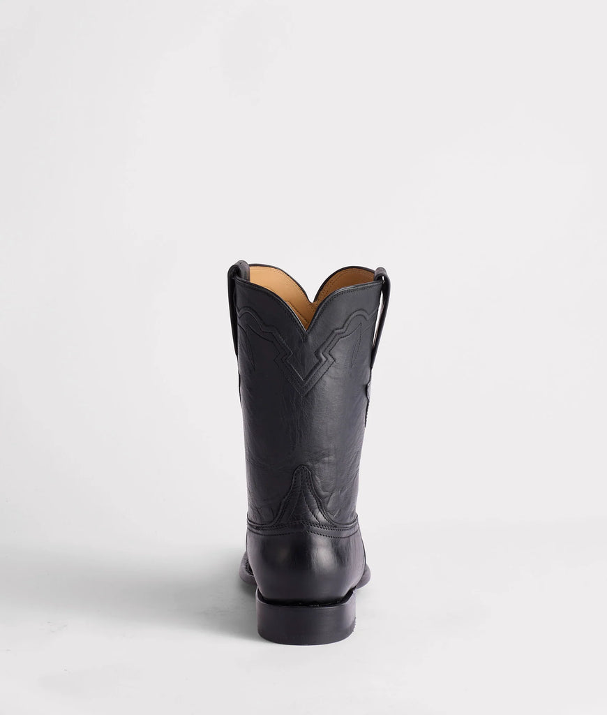Black cowboy boot on a white background