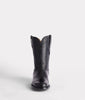 Black cowboy boot on a white background
