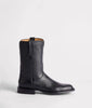 Black leather boot on a light gray background