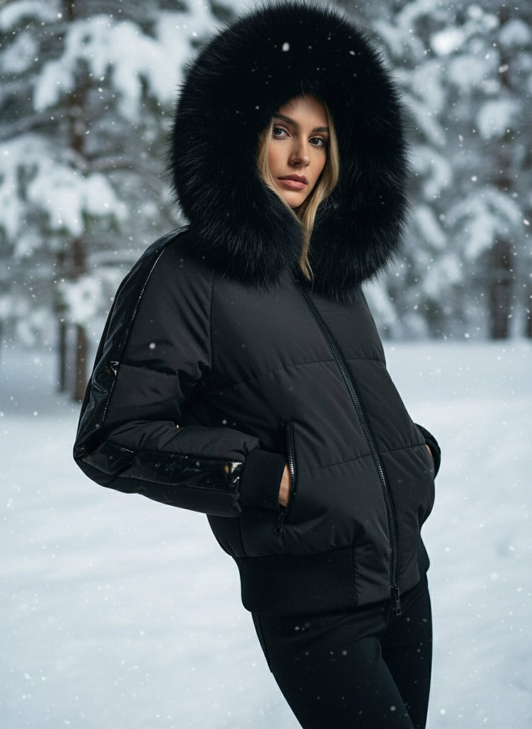 Black puffer ski jacket with fur hood on a mannequin in a store setting