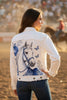 A white denim jacket with a large blue and white graphic print of a horse on the back, displayed on a mannequin in a store with cowboy boots on shelves in the background.