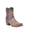 Decorative cowboy boot with intricate patterns on a black background