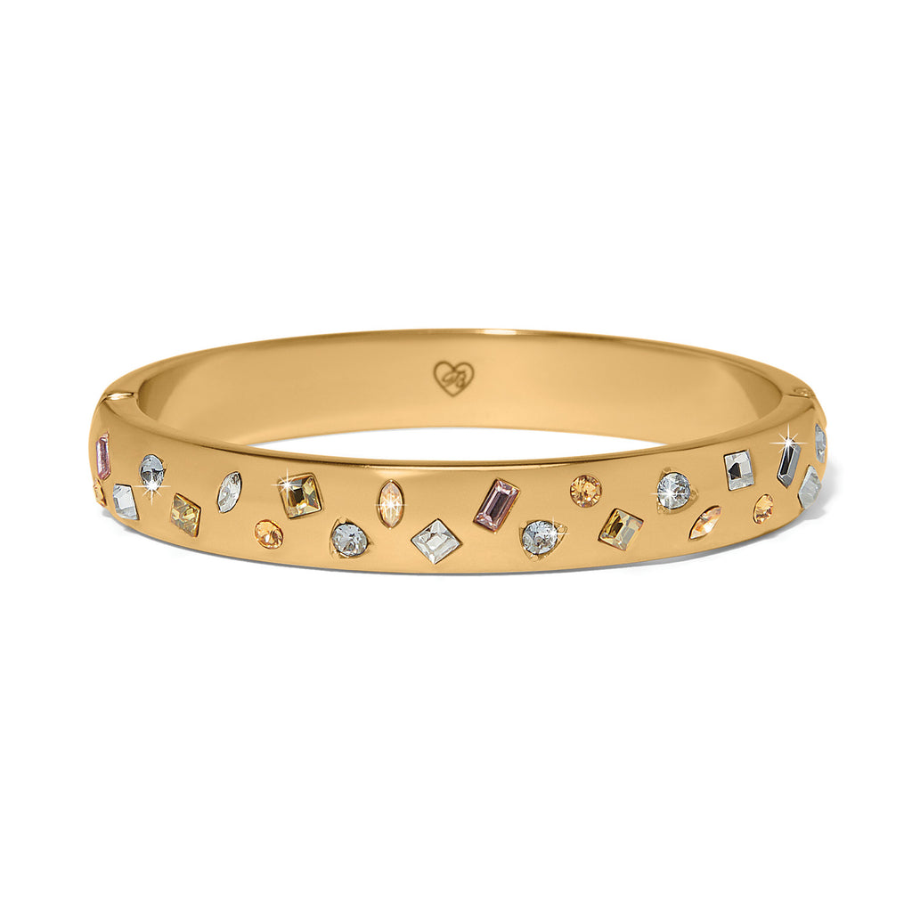 Gold bracelet with embedded crystals on a white background