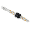 Wristwatch with a black face and silver and gold bracelet on a white background