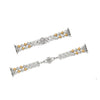 Silver and gold bracelet on a white background